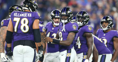 Ravens huddle with Lamar Jackson