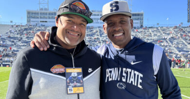 Brad Jackson and Penn State defensive backs coach Anthony Poindexter