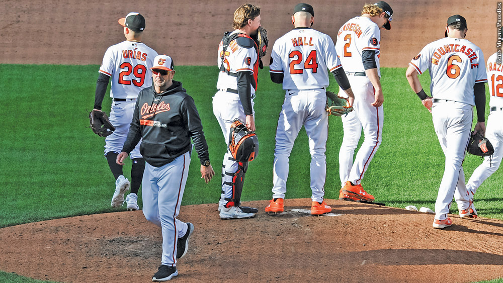 Brandon Hyde gives the ball to left DL Hall in Game 1 of the ALDS