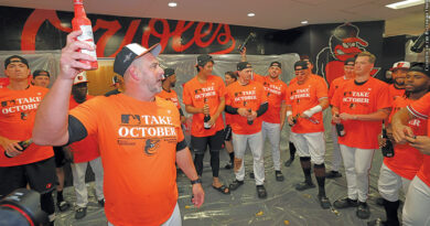 Brandon Hyde leads the celebration after the Orioles clinched a playoff berth