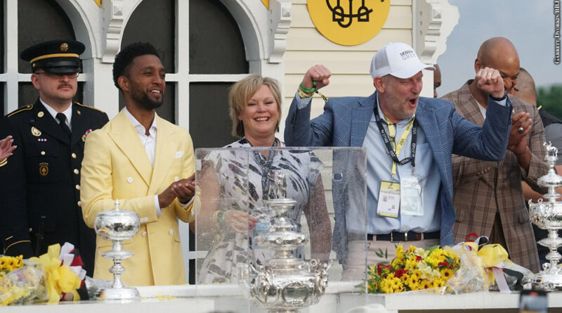 MyRacehorse CEO Michael Behrens (in blue jacket)