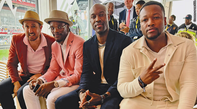 Randall Lane (far left) and Kai Cunningham (far right) meet Lamar Jackson at the Preakness in May