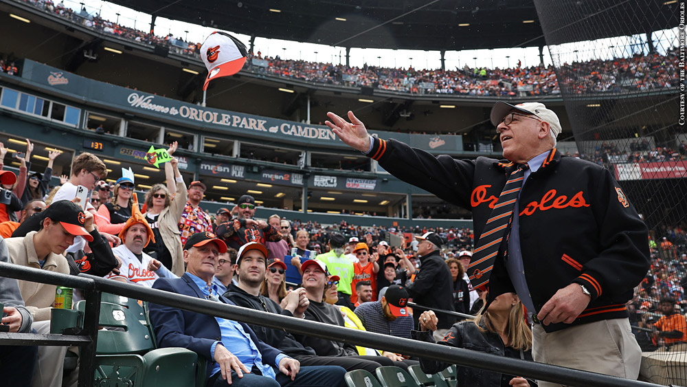 David Rubenstein tosses hats into the stands