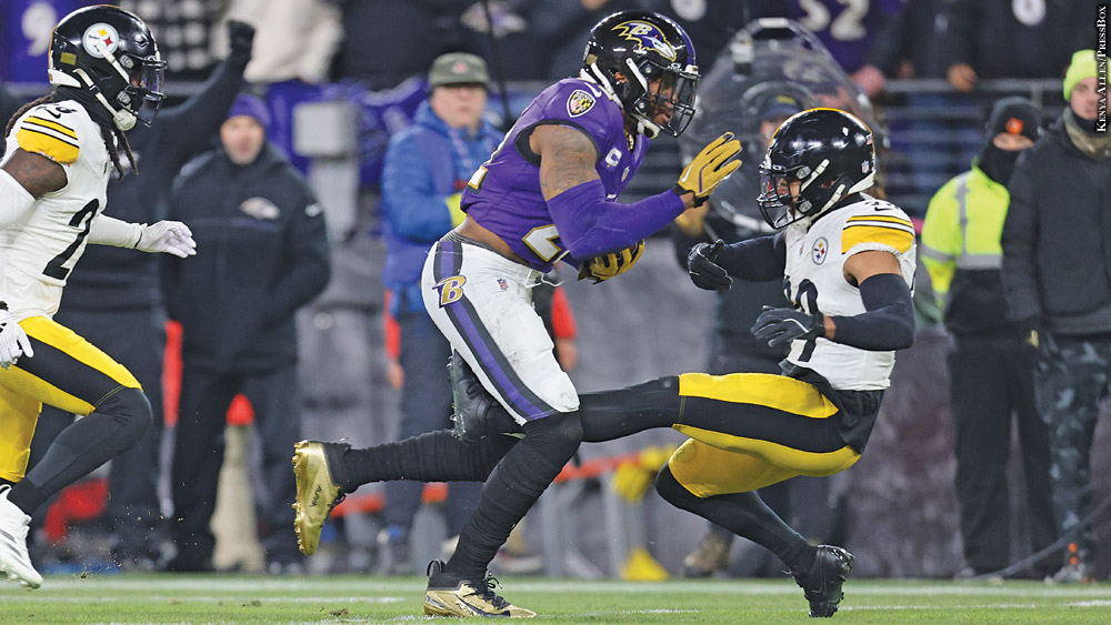 Derrick Henry stiff-arming Minkah Fitzpatrick
